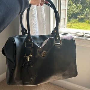 Tory Burch black “barrel bag” gold details
